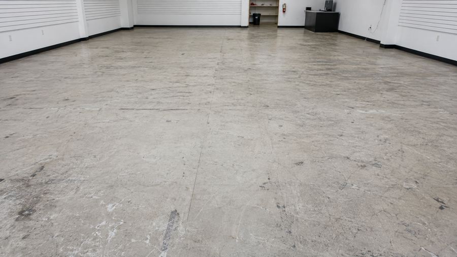 Worn retail floor before refinishing
